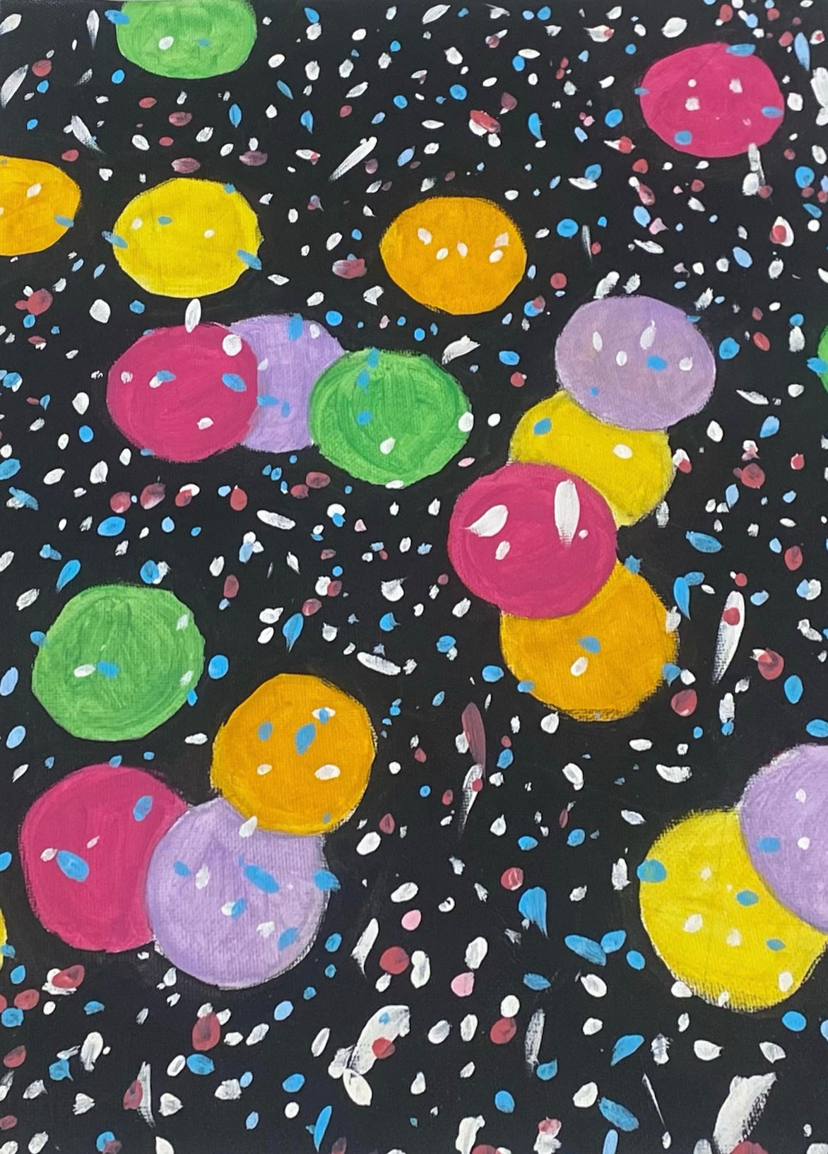 Colorful polka dot pattern on a black background
