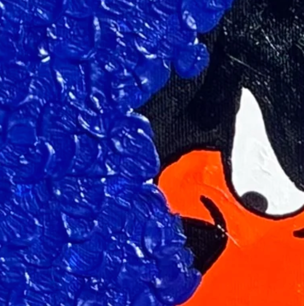 Close-up of blue background with a black and white object partially visible