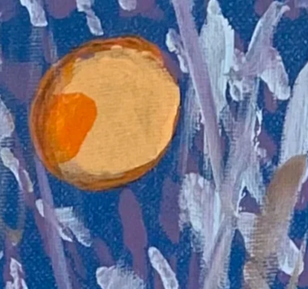 Close-up of a textured fabric with orange and purple patterns