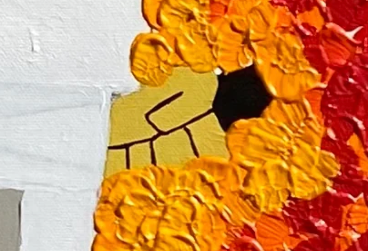 Close-up of a textured surface with orange and red patterns