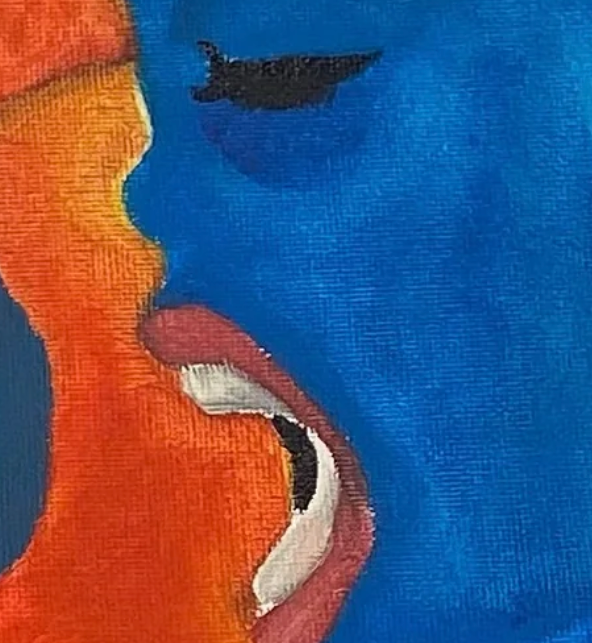 Close-up of a face with blue skin, orange hair, and red lips.