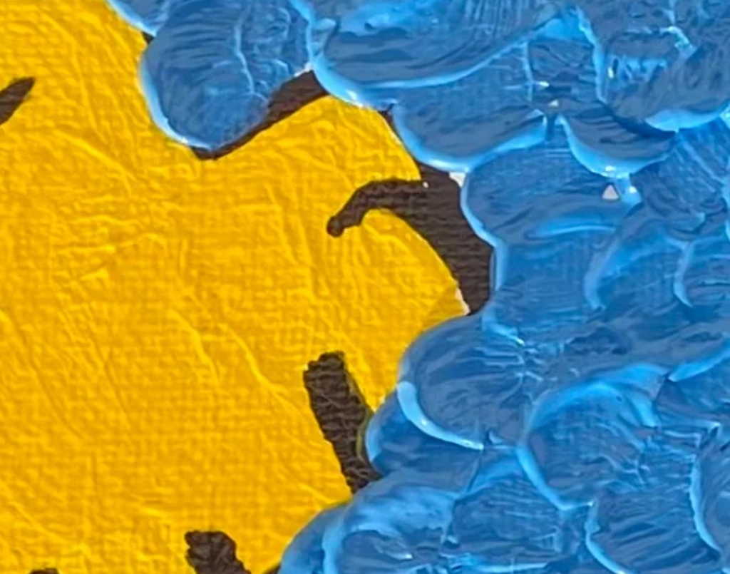 Close-up of a textured fabric with blue and yellow patterns