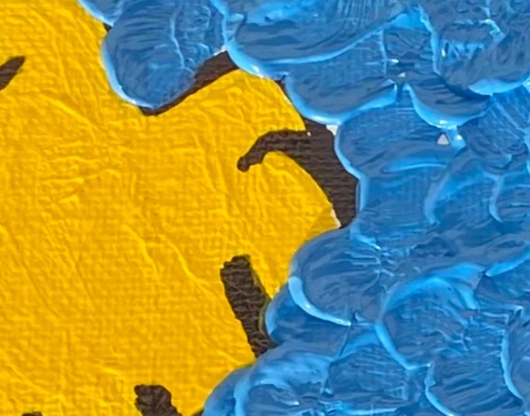 Close-up of a textured fabric with blue and yellow patterns